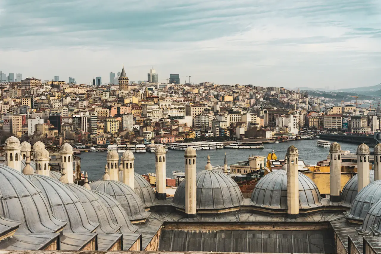 Domed roofs of old Istanbul with the water and the opposite shore in the haze