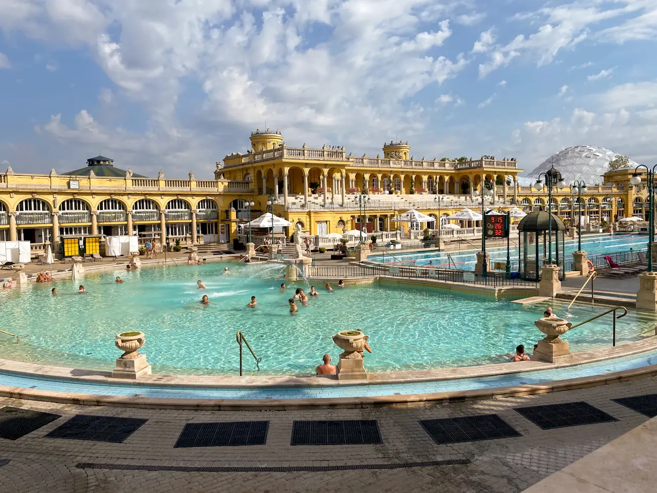 The yellow main building and open-air pools of the Széchenyi Thermal Bath, Budapest