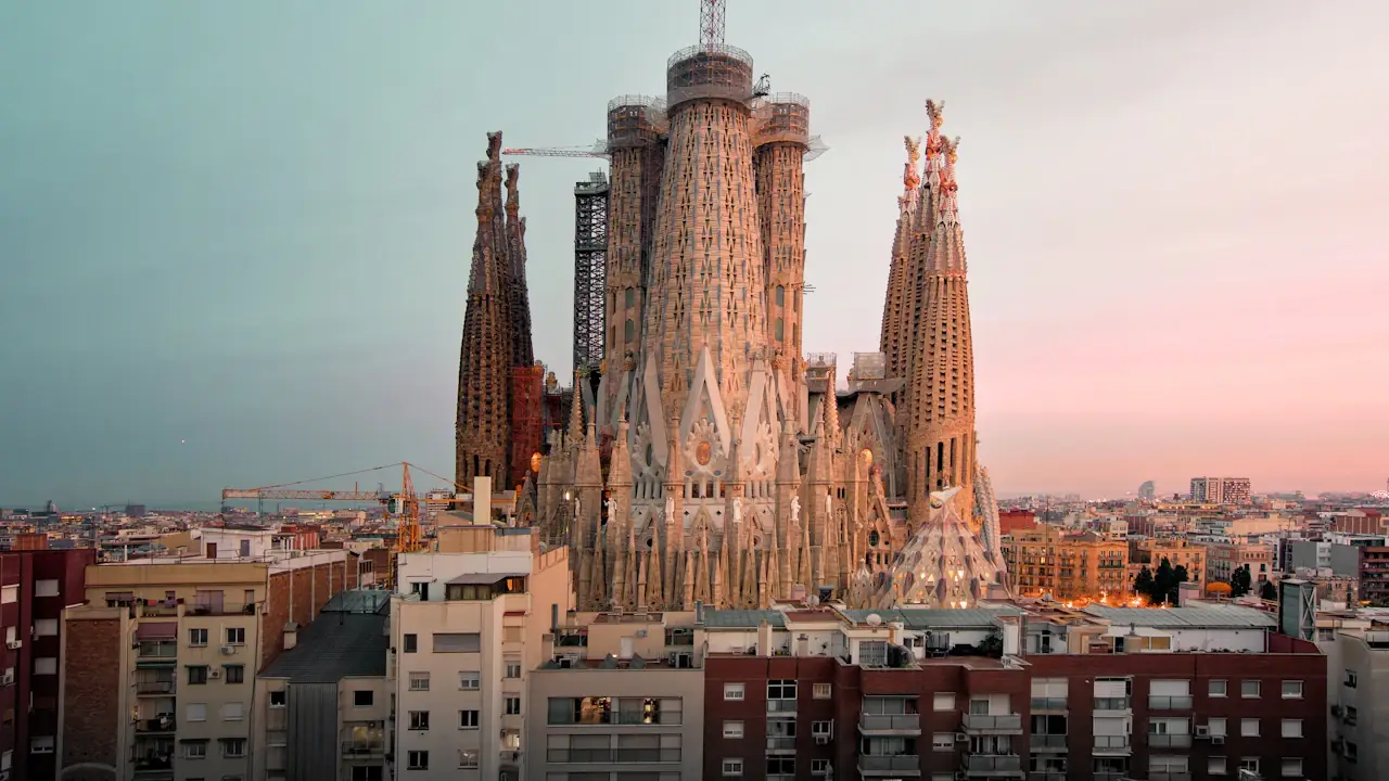 The Sagrada Família above Barcelona rooftops at golden hour