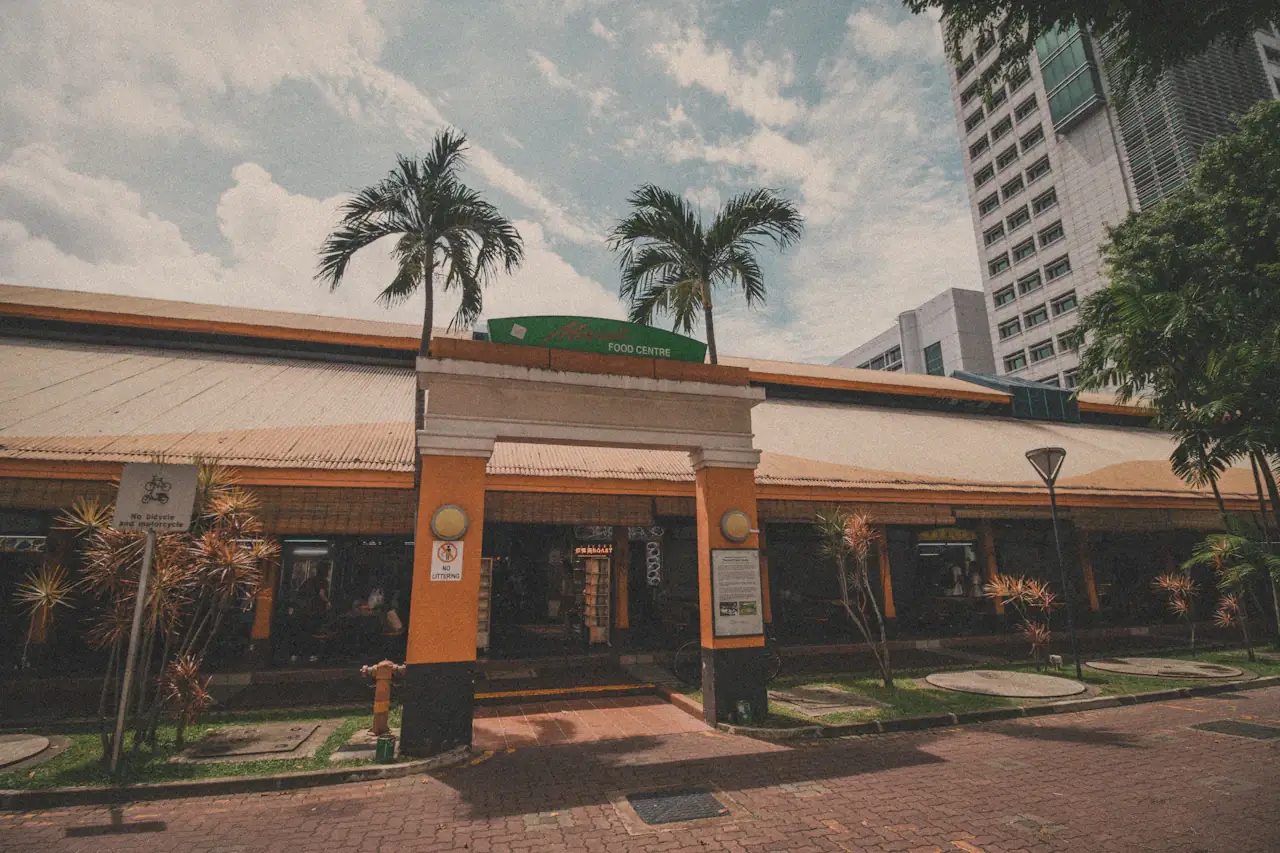The palm-fronted entrance of Maxwell Food Centre, Singapore