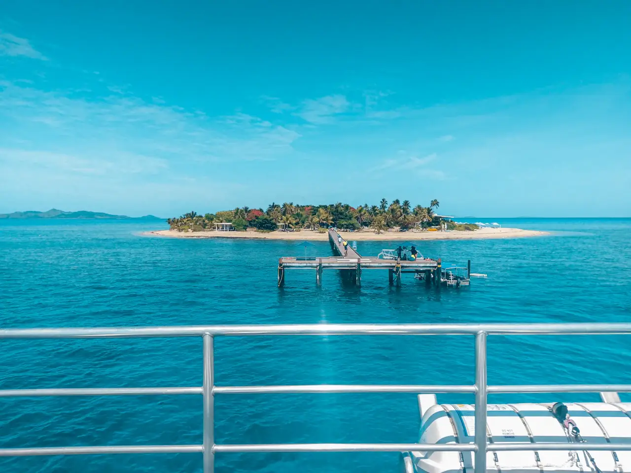 Malolo island, Fiji, seen from a boat across turquoise water