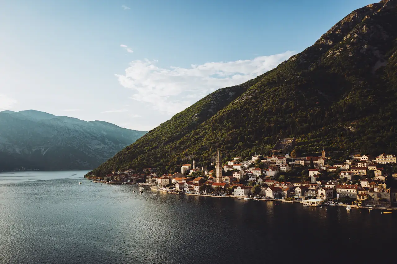 Bird's-eye view of Kotor's old town below the hills on the bay