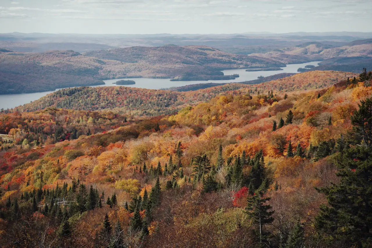 Autumn colours on the hills above a lake at Mont-Tremblant